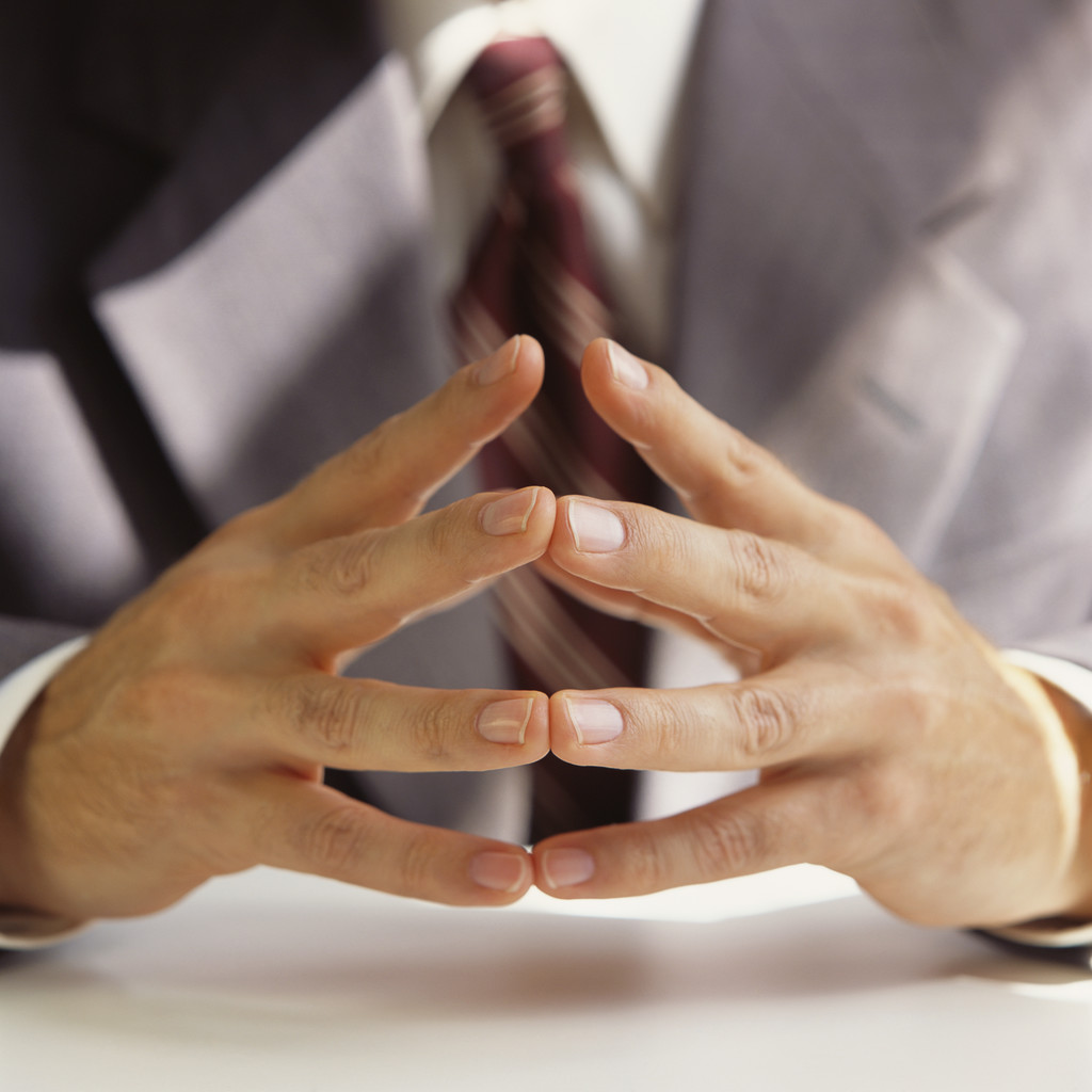 Businessman Clasping Hands